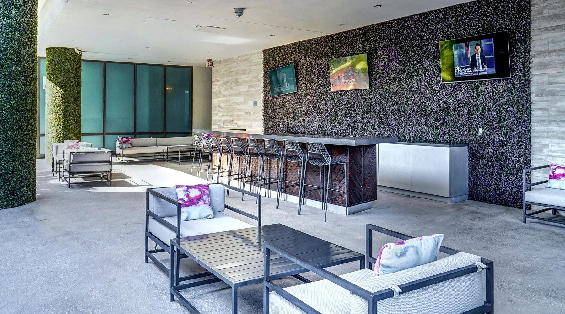Welcome to Midtown 5 outdoor kitchen area under awning near pool