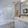 bathroom with a large mirror and modern counter-top