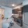 well lit entryway opens to kitchen and dining areas adjacent to bathroom