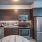 kitchen along wall in bright studio apartment