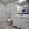 well lit bathroom with shower/tub combo in studio apartment