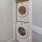 stackable washer/dryer in laundry closet next to bathroom